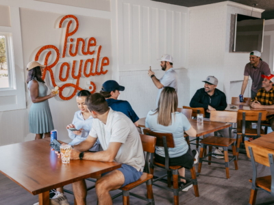 A busy afternoon in the Pine Royale dining room, one guest taking a photo of the sign