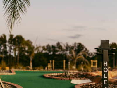 The palm-lined path to hole 9 at Mini Royale at dusk
