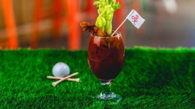 The Birdie Mary: a Bloody Mary garnished with bacon, celery and a PR flag